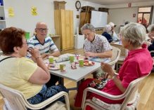 A group of people sitting around a table

Description automatically generated
