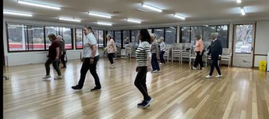 A group of people in a room

Description automatically generated