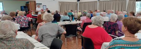 A group of people sitting in chairs

Description automatically generated